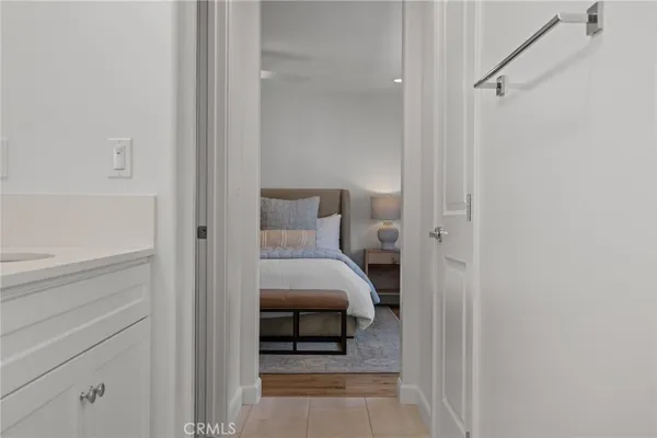 a bedroom with a bed and cabinets