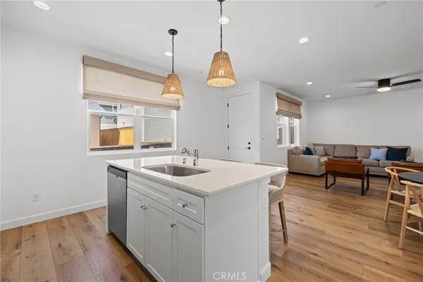 a kitchen with a sink and a refrigerator