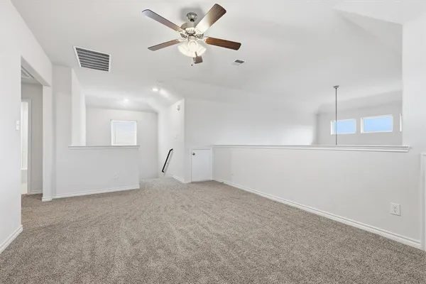 an empty room with fan