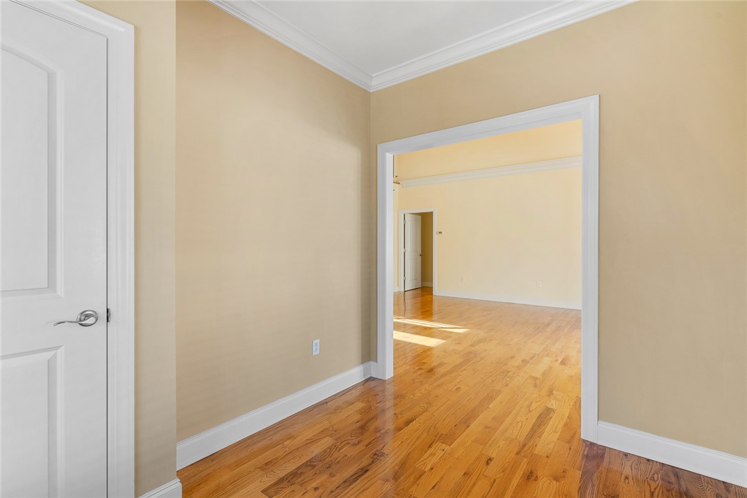 16 Oleander Drive Anderson, SC 29621 - Photo 6 of 37 Bright hardwood floors and crown molding elevate this versatile interior space.