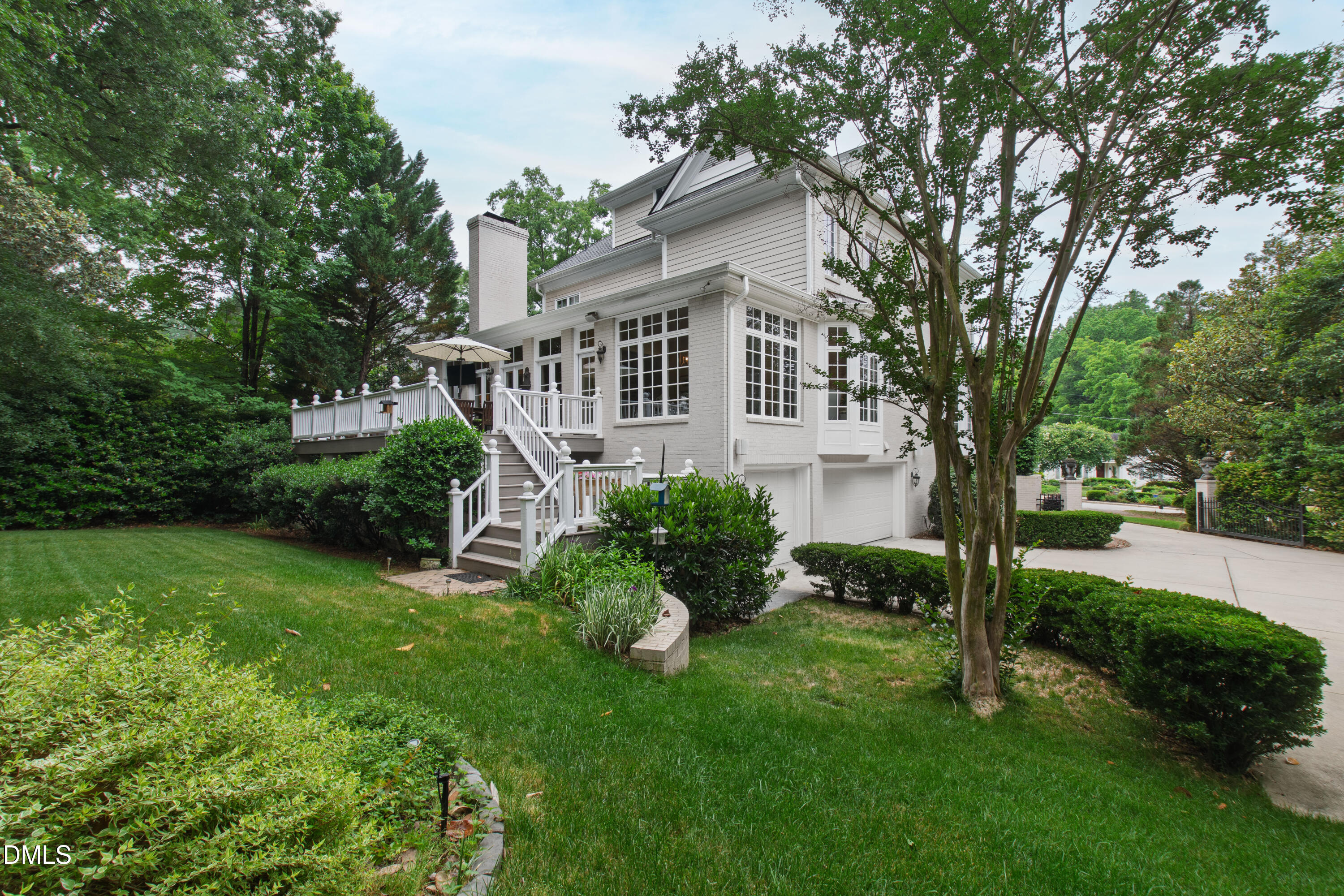 2536 Wake Drive Raleigh, NC 27608 - Photo 69 of 74 a front view of a house with a yard and green space