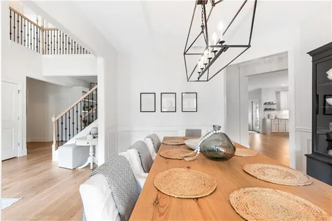 a kitchen with sink a stove and cabinets