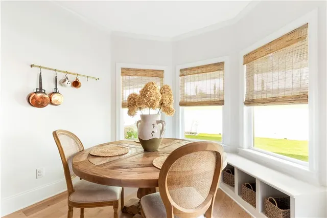 a living room with furniture a window and a table