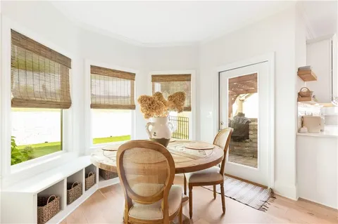 a living room with a bed furniture and a window