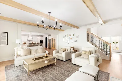 a bathroom with a sink a mirror and a shower