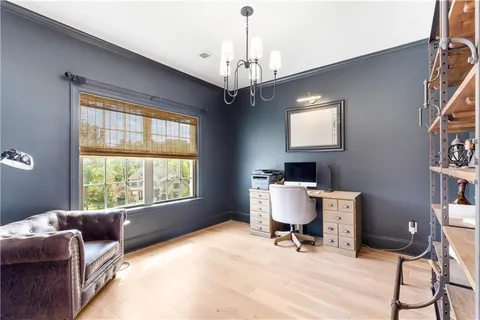 a living room with furniture a window and a table