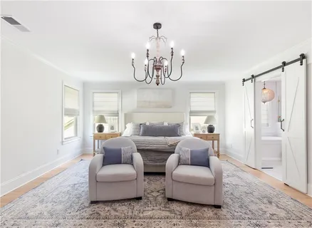 a living room with furniture and entry gate