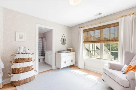 a backyard of a house with barbeque oven table and chairs