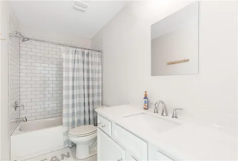 a aerial view of a house with a yard and furniture