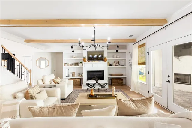 a dining room with a large window and table