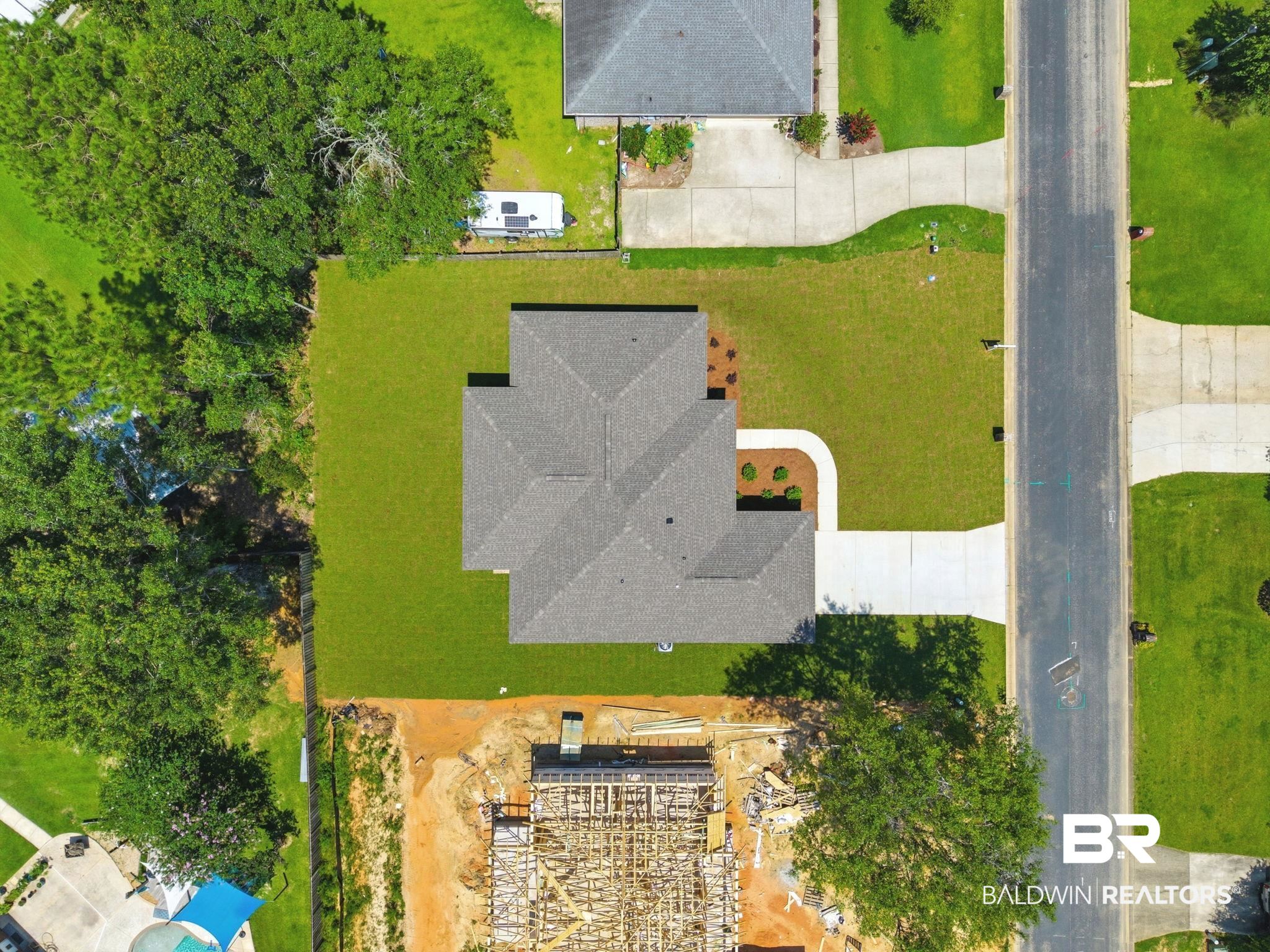 32656 Arbor Ridge Circle Lillian, AL 36549 - Photo 45 of 56 Newly constructed residence featuring a shingled roof and an expansive green lawn