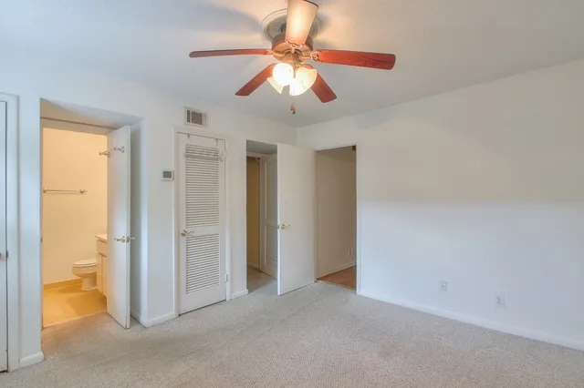 a view of a livingroom with a chandelier fan
