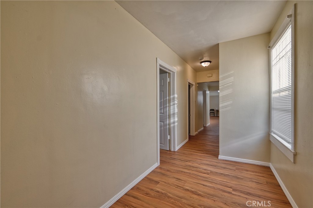 850 West 132nd Street Compton, CA 90222 - Photo 12 of 23 a view of a hallway with wooden floor