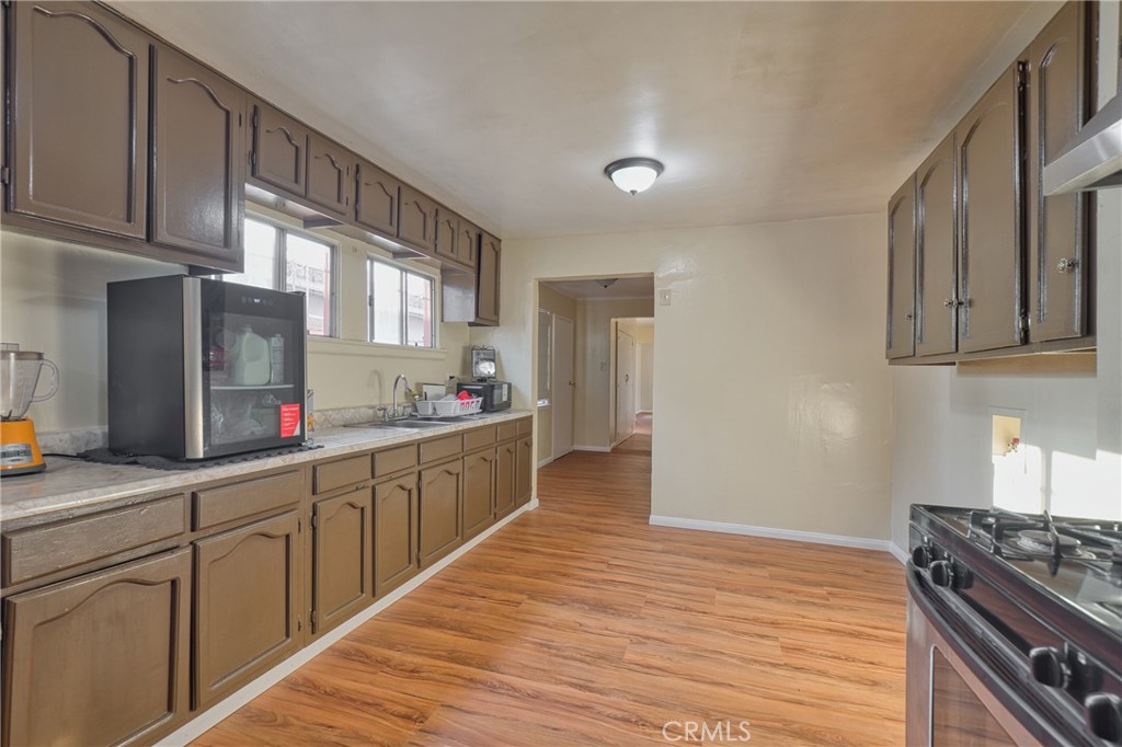 850 West 132nd Street Compton, CA 90222 - Photo 14 of 23 a kitchen with stainless steel appliances granite countertop a refrigerator sink and cabinets