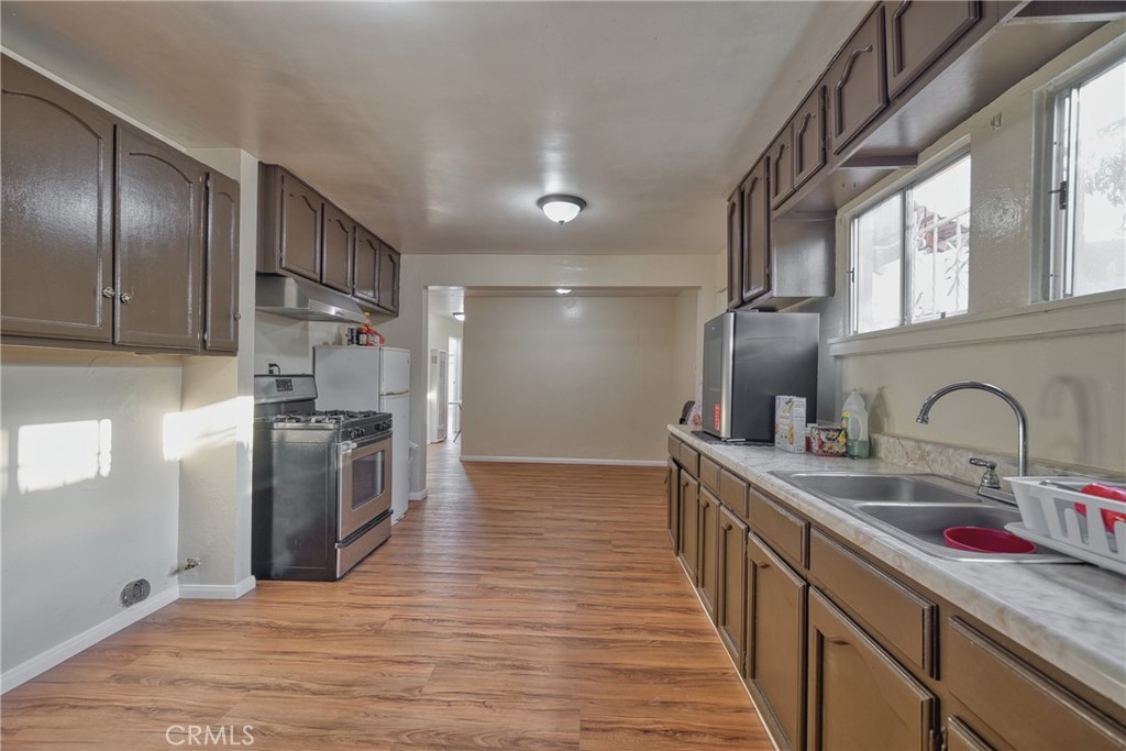 850 West 132nd Street Compton, CA 90222 - Photo 15 of 23 a kitchen with stainless steel appliances granite countertop a sink stove and refrigerator