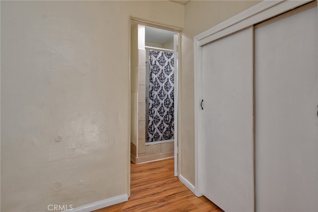 850 West 132nd Street Compton, CA 90222 - Photo 17 of 23 a view of a hallway with wooden floor and closet