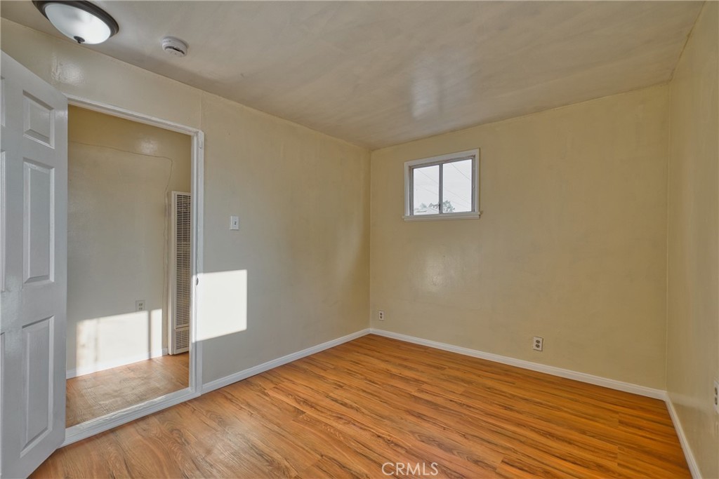 850 West 132nd Street Compton, CA 90222 - Photo 20 of 23 a view of empty room with wooden floor and fan