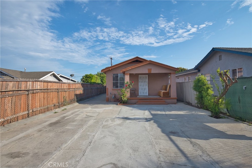 850 West 132nd Street Compton, CA 90222 - Photo 2 of 23 a front view of a house with a yard and garage