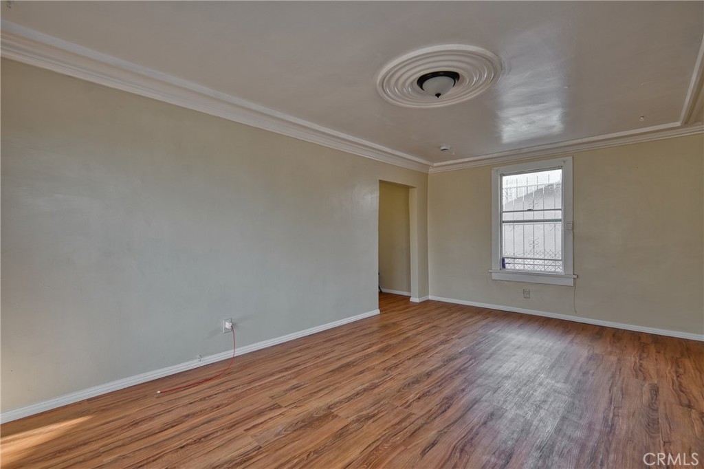 850 West 132nd Street Compton, CA 90222 - Photo 5 of 23 wooden floor in an empty room with a window