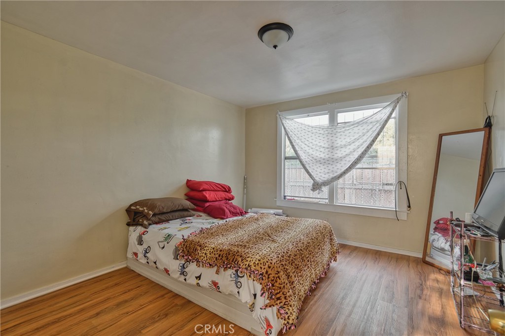 850 West 132nd Street Compton, CA 90222 - Photo 6 of 23 a bedroom with a bed and a flat screen tv