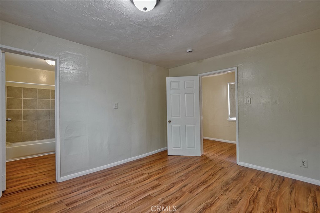 850 West 132nd Street Compton, CA 90222 - Photo 9 of 23 a view of an empty room with wooden floor