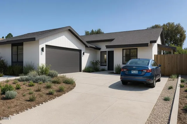 a kitchen with stainless steel appliances granite countertop a refrigerator and a stove