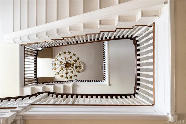 a living room with furniture large window and a fireplace