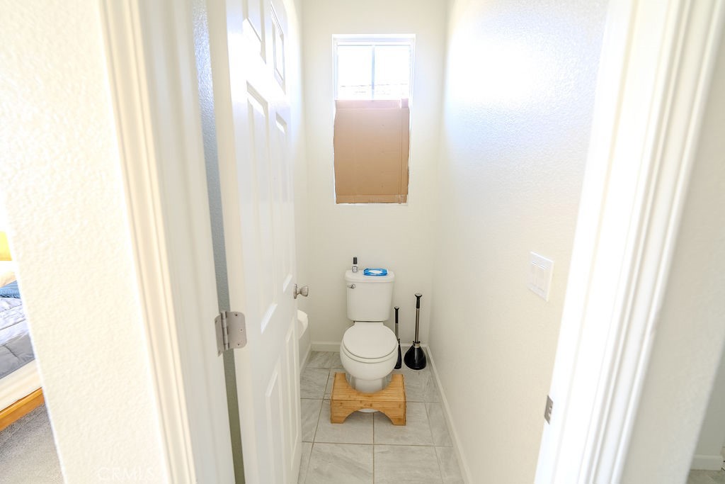 313 Orso Way Oakley, CA 94561 - Photo 12 of 25 a bathroom with a toilet and a sink