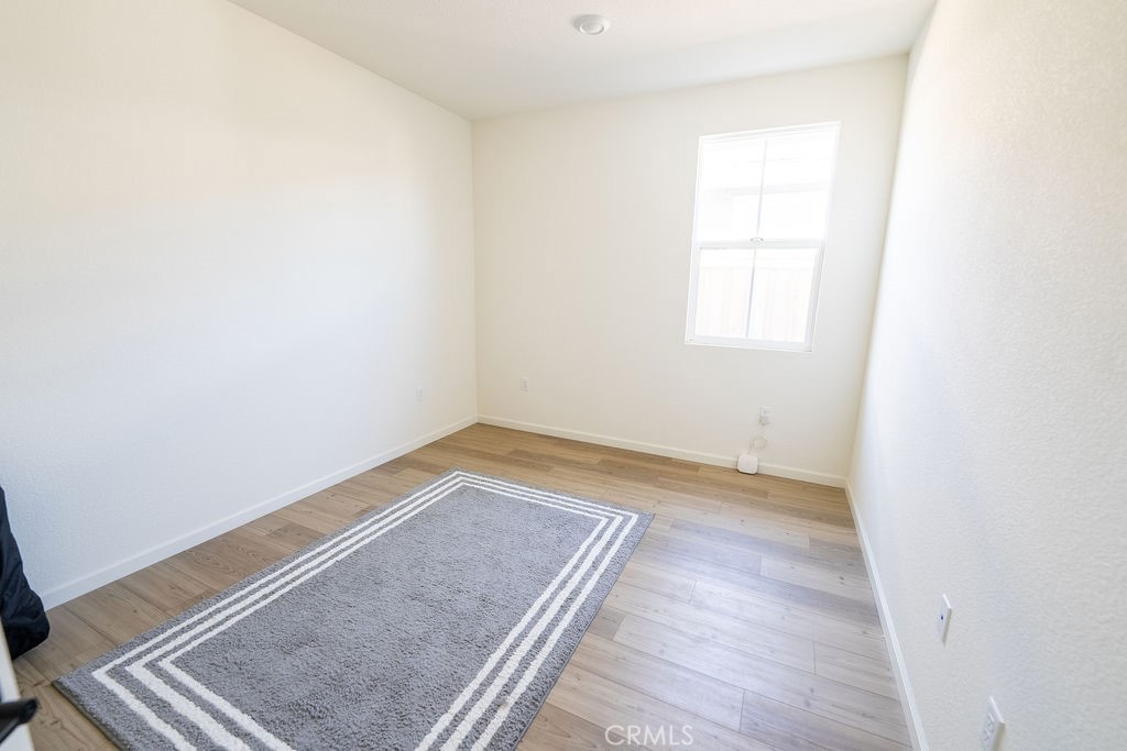 313 Orso Way Oakley, CA 94561 - Photo 17 of 25 an empty room with wooden floor and closet