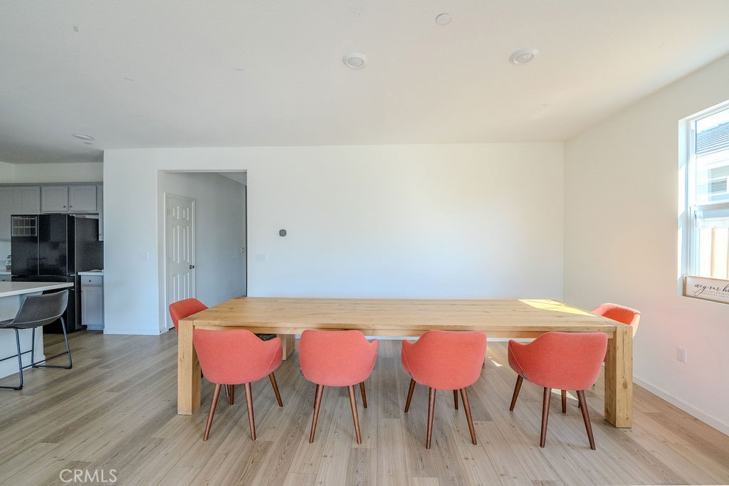 313 Orso Way Oakley, CA 94561 - Photo 4 of 25 a view of a dining room with furniture and wooden floor