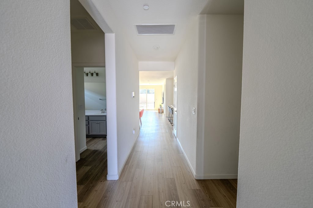 313 Orso Way Oakley, CA 94561 - Photo 6 of 25 a view of a hallway with wooden floor