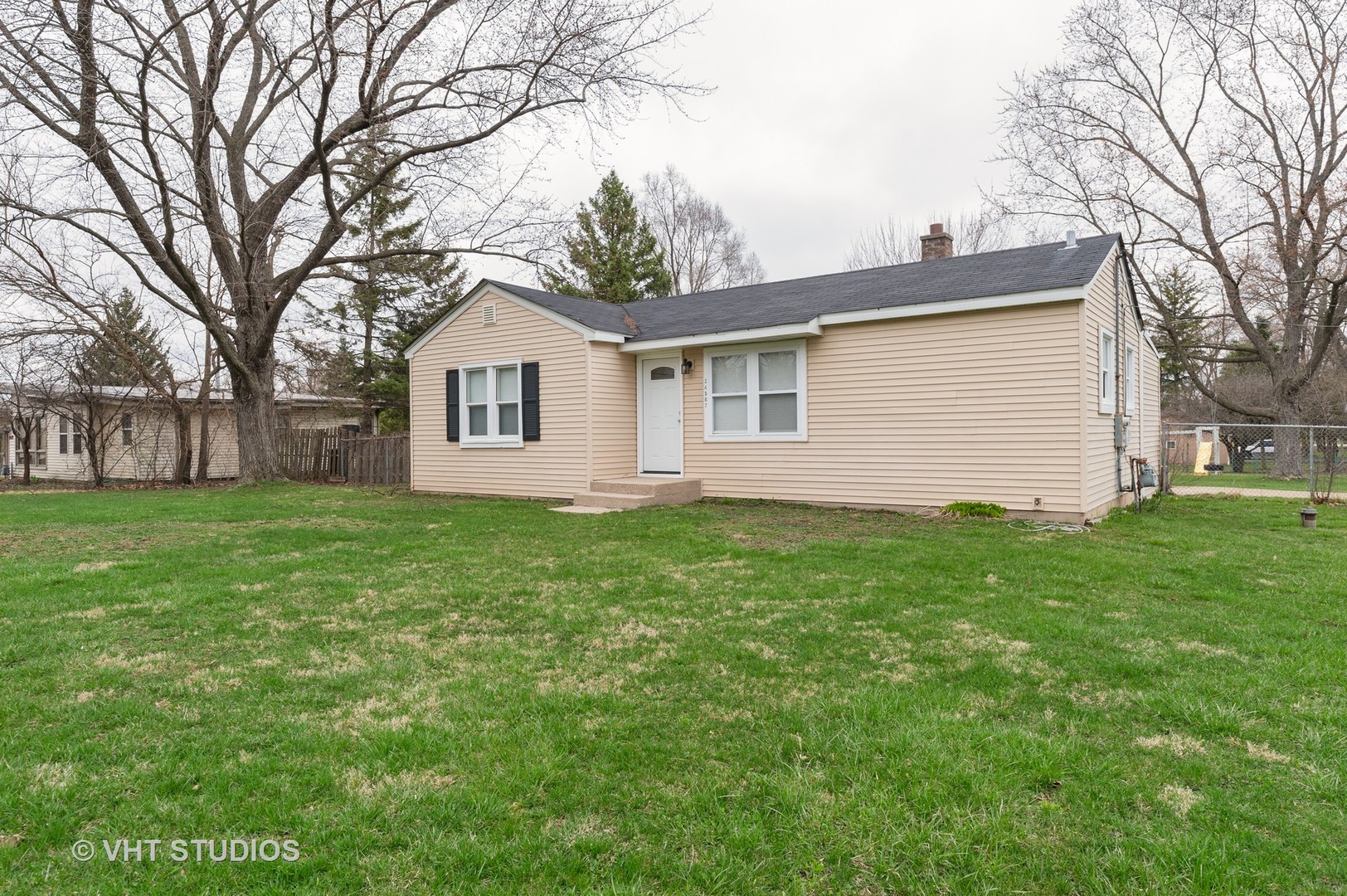 34587 North Wilson Road Ingleside, IL 60041 - Photo 1 of 10 a front view of house with yard and green space