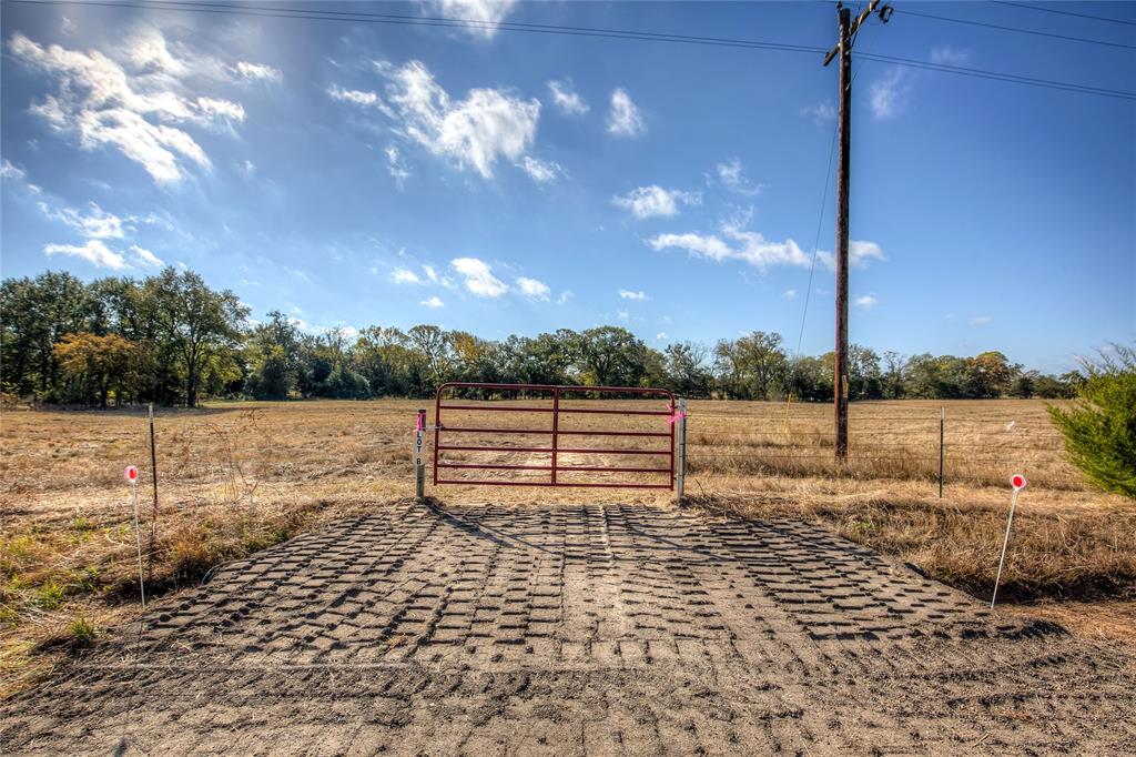 1468 County Road 1468 Quitman, TX 75783 - Photo 2 of 14 a view of a yard with an empty space and deck