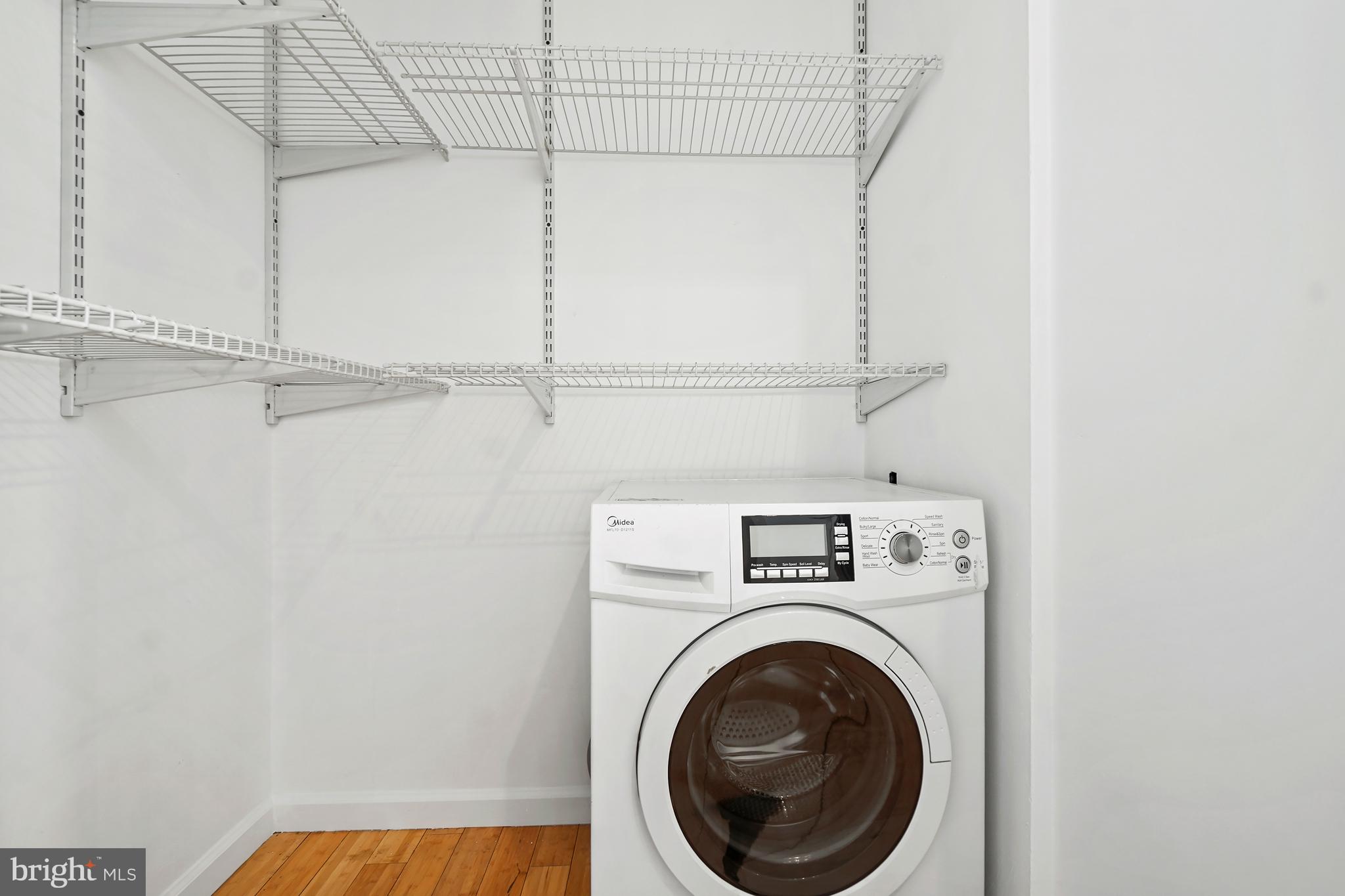 1822 15th Street Northwest, Unit 303 Washington, DC 20009 - Photo 19 of 22 a view of a storage & utility room with racks on the wall