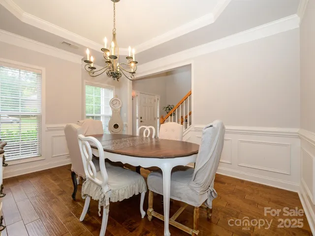 a view of a dining room with furniture and window