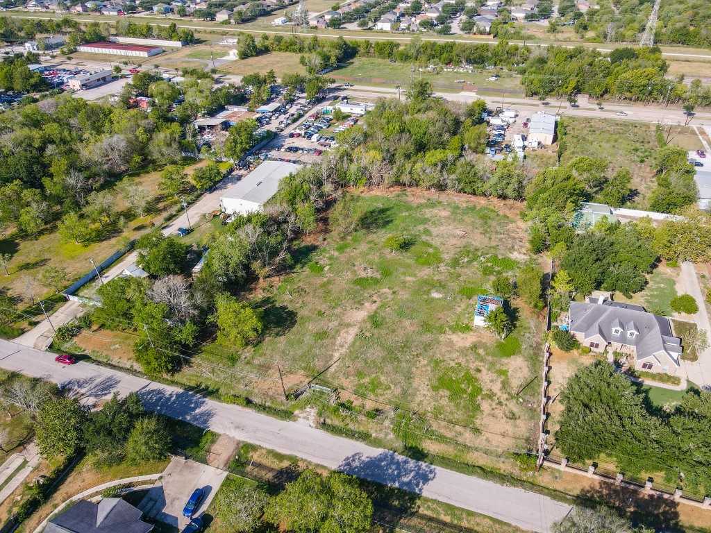 13932 Wrigley Street Houston, TX 77045 - Photo 2 of 8 an aerial view of residential houses with outdoor space
