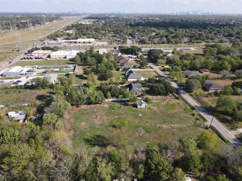 13932 Wrigley Street Houston, TX 77045 - Photo 5 of 8 an aerial view of residential houses with outdoor space and trees