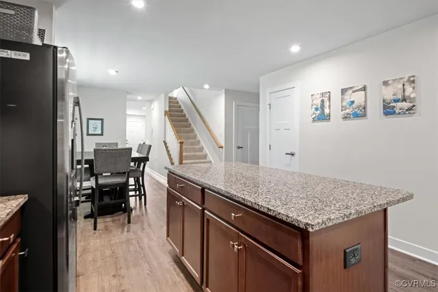 a view of kitchen with furniture and wooden floor