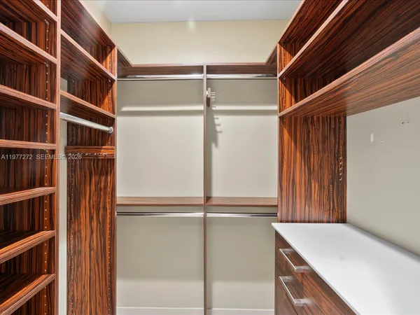 a spacious bathroom with a double vanity sink and a mirror