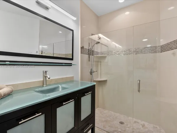 a bedroom with a bed and a cabinets