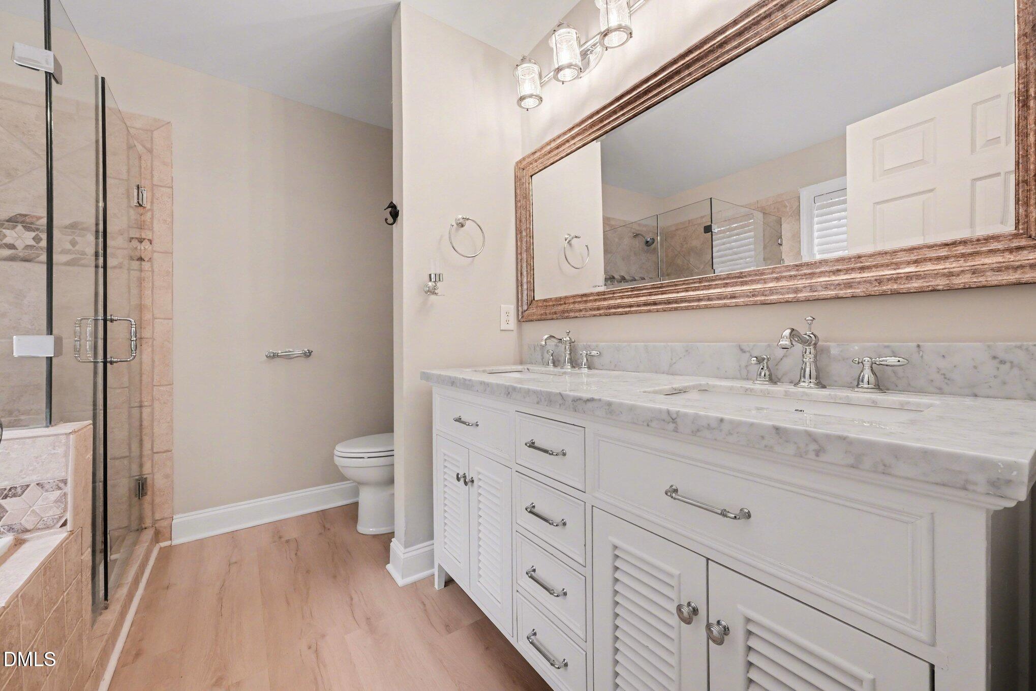 4613 Cherrybark Lane Raleigh, NC 27616 - Photo 14 of 27 a bathroom with a granite countertop sink toilet and shower