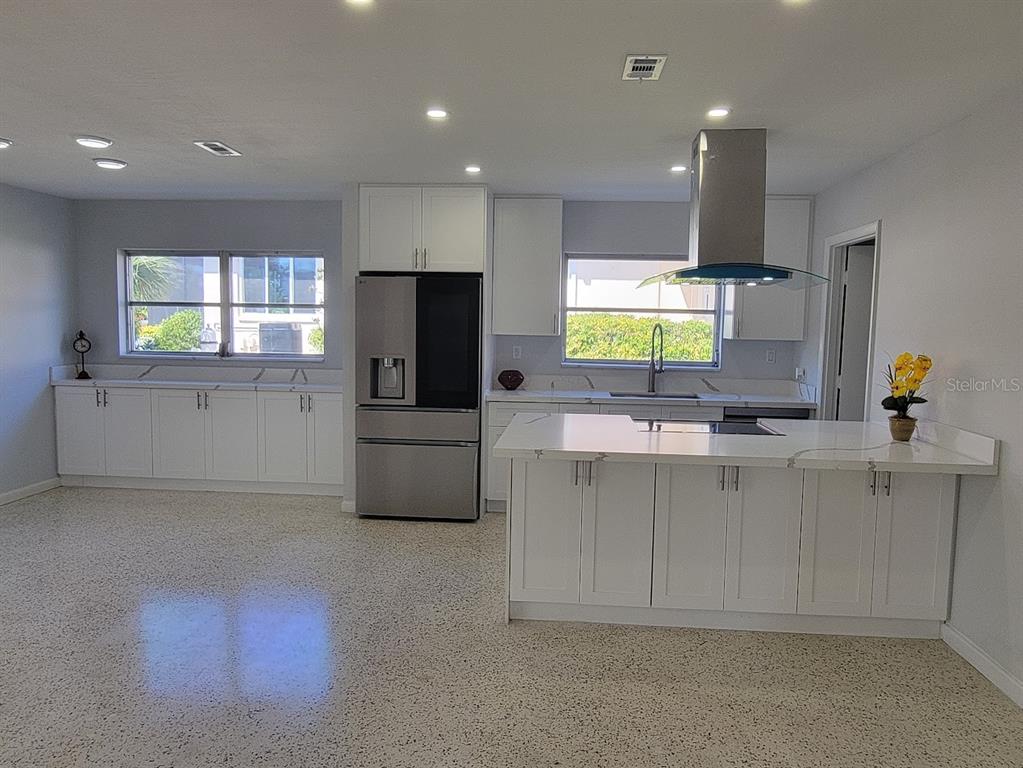 1732 Boca Raton Court Punta Gorda, FL 33950 - Photo 29 of 64 a kitchen with stainless steel appliances a microwave a sink and a refrigerator