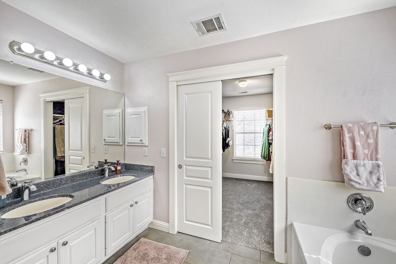 9504 Prescott Drive Austin, TX 78749 - Photo 15 of 33 Primary bath with dual vanities and a huge walk-in closet.