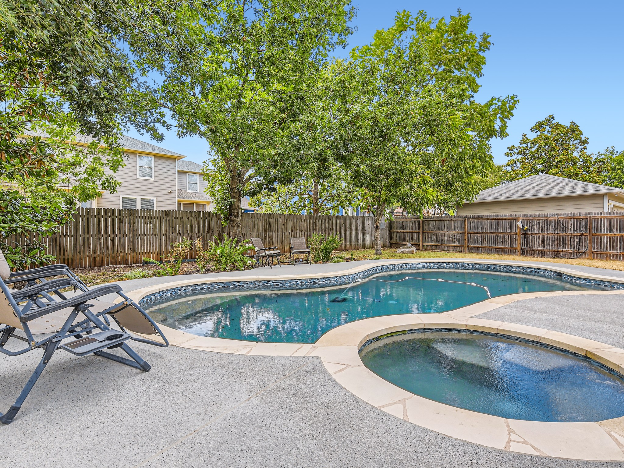 9504 Prescott Drive Austin, TX 78749 - Photo 21 of 33 Sparkling backyard pool surrounded by patio space for relaxing or hosting friends.