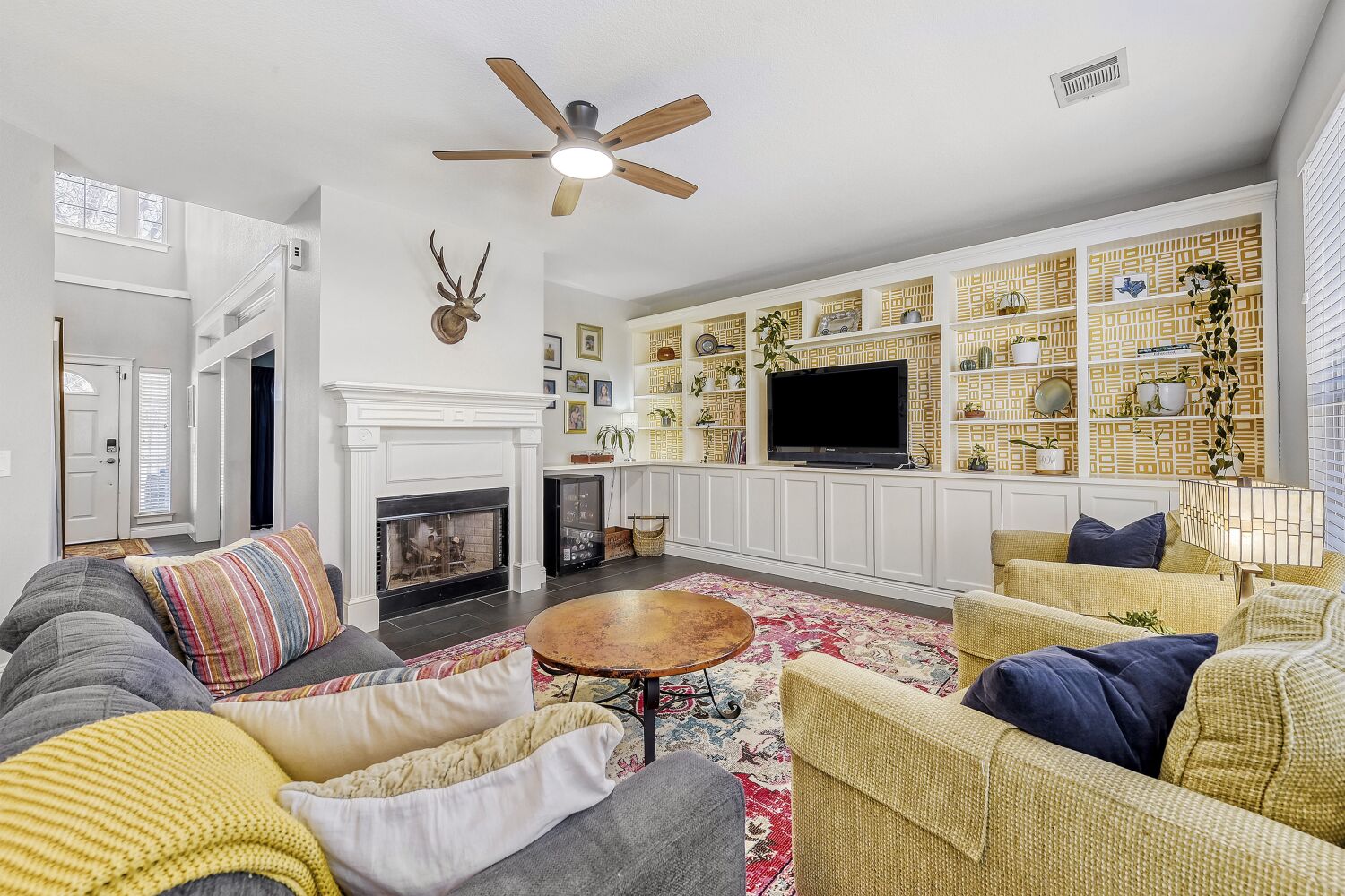 9504 Prescott Drive Austin, TX 78749 - Photo 5 of 33 Living area with cozy fireplace and built-ins for great storage.