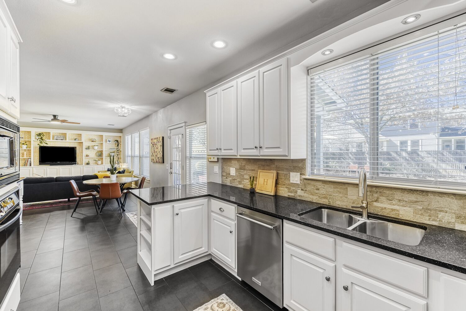 9504 Prescott Drive Austin, TX 78749 - Photo 9 of 33 Backyard views add a nice touch while preparing meals.