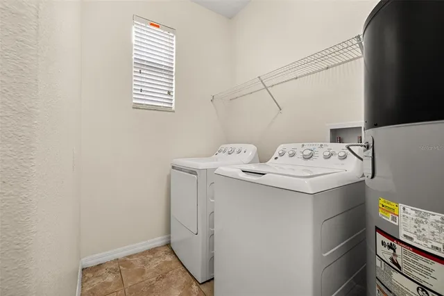 a bed room with a bed and a ceiling fan