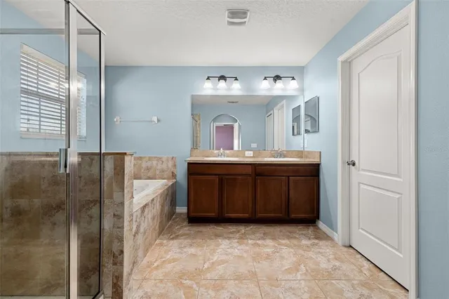 a view of a deck with wooden floor and fence