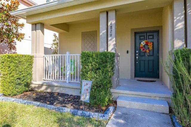a view of a chairs and table in backyard