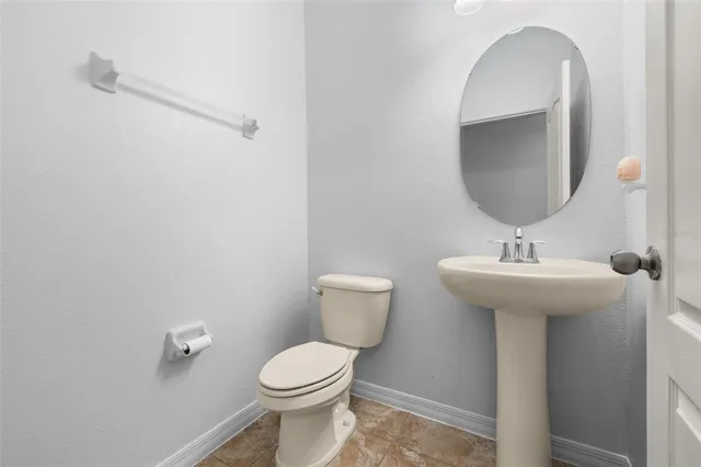 a view of a chandelier in big room with chandelier fan